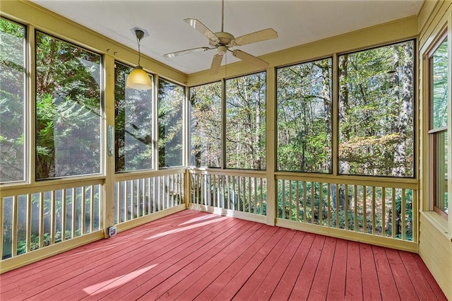 unfurnished sunroom with ceiling fan and a wealth of natural light