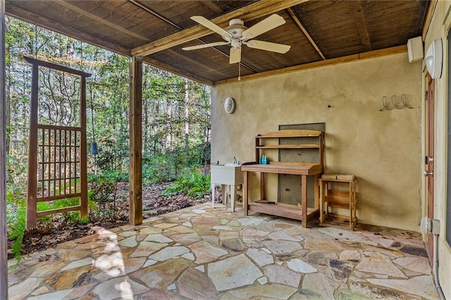 rear view of property featuring a sunroom and a balcony