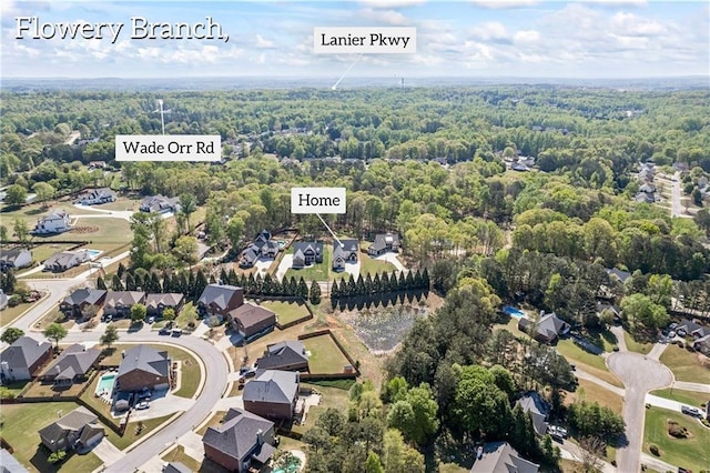 6238 Mount Salem Cir, Flowery Branch, GA 30542 - aerial view of property and surrounding area with a heavily wooded area and nearby suburban area
