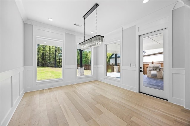 6238 Mount Salem Cir, Flowery Branch, GA 30542 - unfurnished dining area with a decorative wall, light wood finished floors, healthy amount of natural light, recessed lighting, and wainscoting