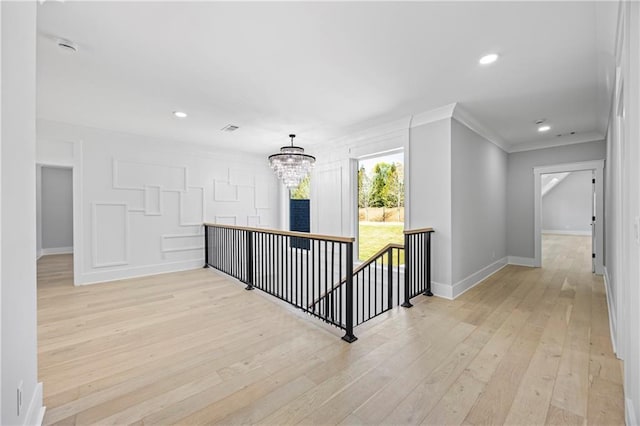 6238 Mount Salem Cir, Flowery Branch, GA 30542 - corridor with an upstairs landing, a chandelier, light wood-type flooring, ornamental molding, and recessed lighting