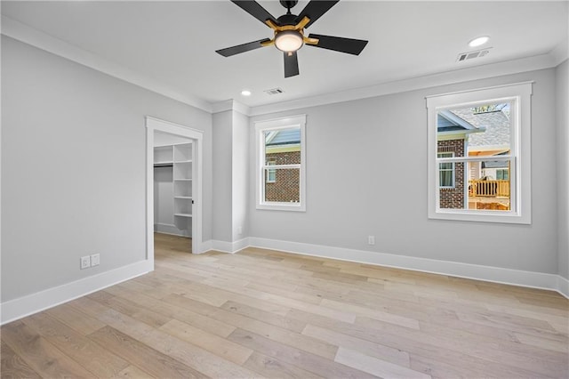 6238 Mount Salem Cir, Flowery Branch, GA 30542 - unfurnished bedroom featuring multiple windows, light wood-style flooring, a spacious closet, ornamental molding, and recessed lighting