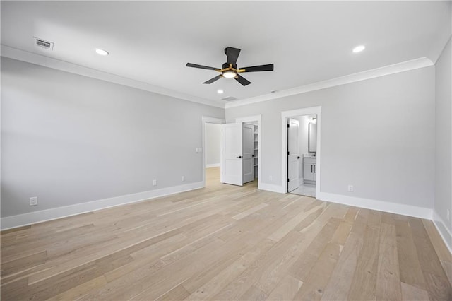6238 Mount Salem Cir, Flowery Branch, GA 30542 - unfurnished bedroom with crown molding, light wood-style floors, a walk in closet, connected bathroom, and recessed lighting