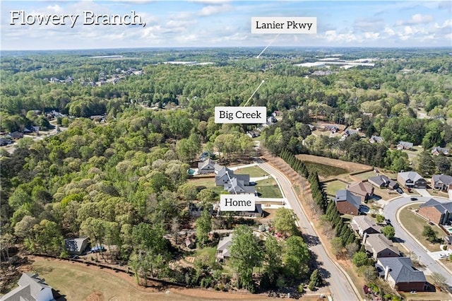 6238 Mount Salem Cir, Flowery Branch, GA 30542 - aerial view of property and surrounding area featuring a heavily wooded area and nearby suburban area