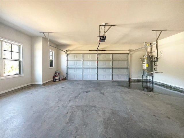 garage with gas water heater, a garage door opener, and baseboards