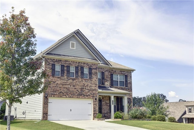 view of front of home with a garage and a front lawn