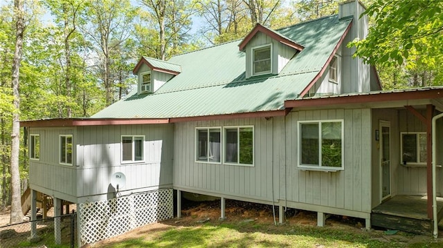 rear view of house with metal roof