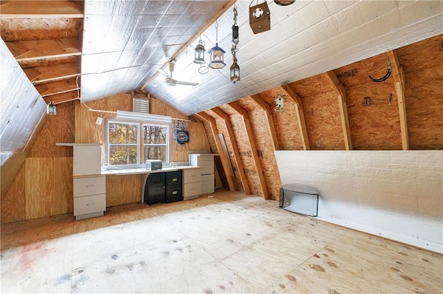 additional living space featuring lofted ceiling