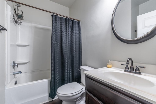 full bathroom with vanity, shower / tub combo, and toilet