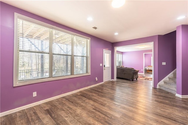 spare room with wood-type flooring