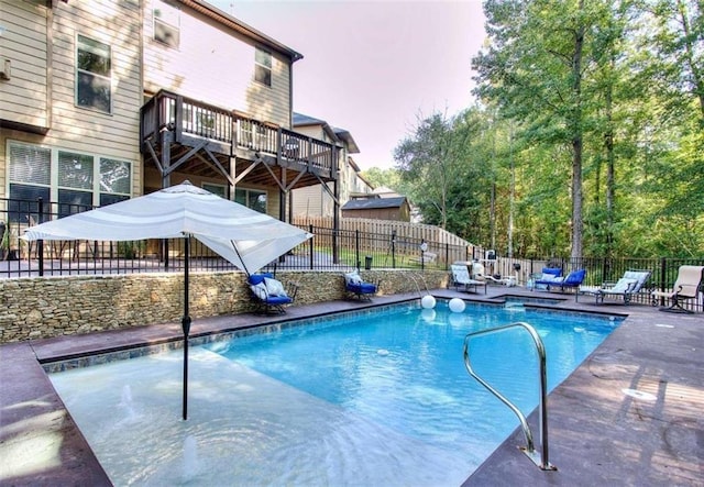 view of pool at dusk