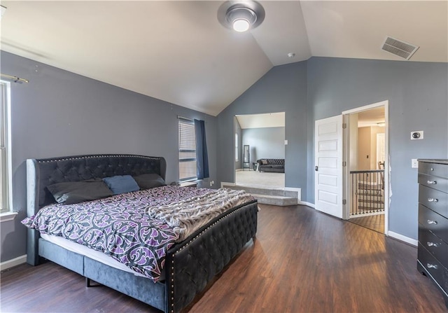bedroom featuring lofted ceiling and dark hardwood / wood-style floors