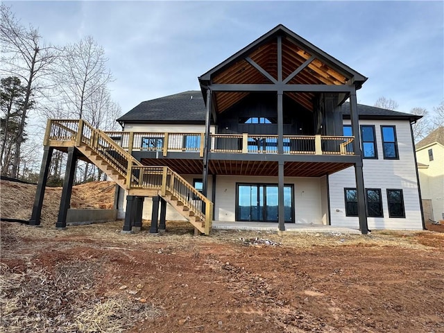 rear view of house featuring a deck