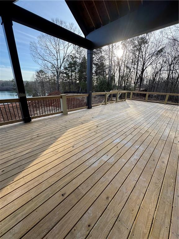 wooden deck with a water view