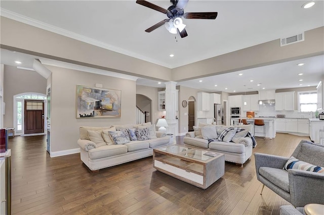 13015 Fox Rd, Alpharetta, GA 30005 - living room with decorative columns, a ceiling fan, hardwood / wood-style floors, recessed lighting, and stairs