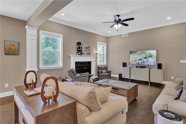 13015 Fox Rd, Alpharetta, GA 30005 - living area featuring ornate columns, healthy amount of natural light, ceiling fan, a glass covered fireplace, and recessed lighting