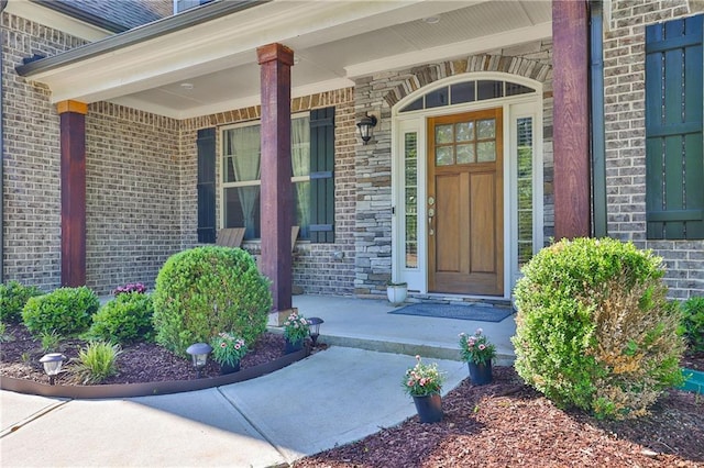 13015 Fox Rd, Alpharetta, GA 30005 - view of exterior entry with brick siding and a porch
