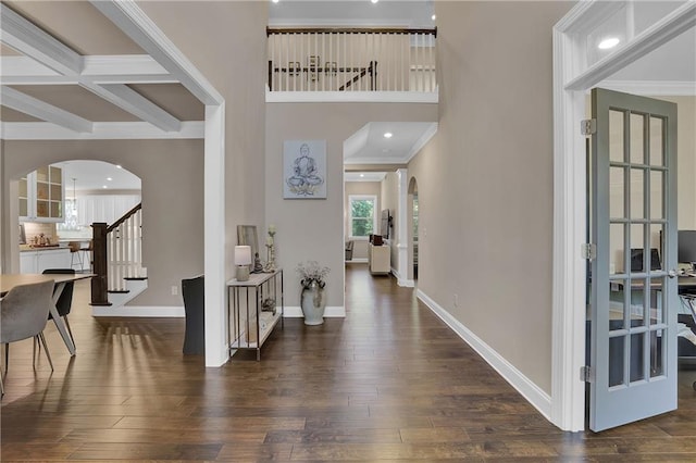 13015 Fox Rd, Alpharetta, GA 30005 - foyer with arched walkways, stairs, dark wood-style floors, ornamental molding, and beam ceiling