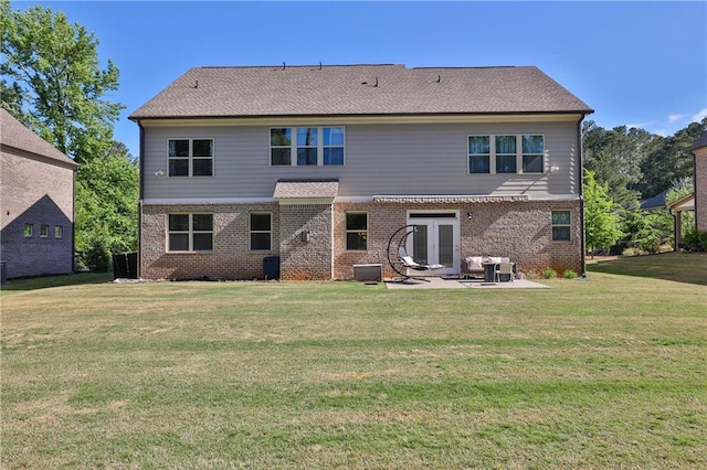 13015 Fox Rd, Alpharetta, GA 30005 - rear view of property featuring french doors, a patio area, a lawn, and brick siding