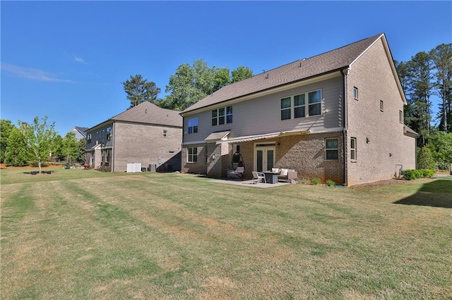 13015 Fox Rd, Alpharetta, GA 30005 - rear view of property with french doors, a yard, a patio, brick siding, and an outdoor hangout area