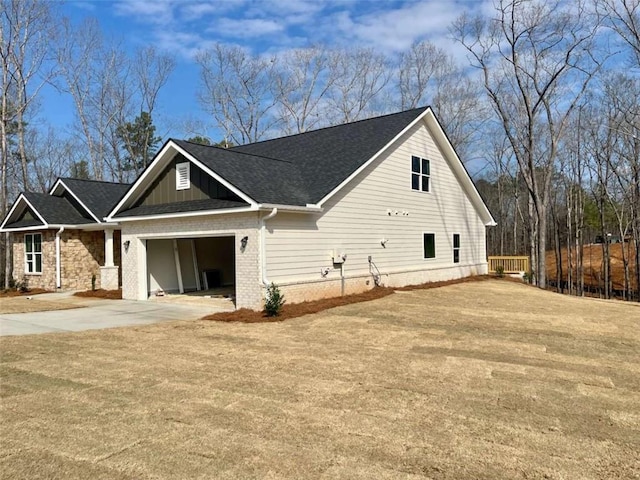 view of front of house with a garage and a front lawn