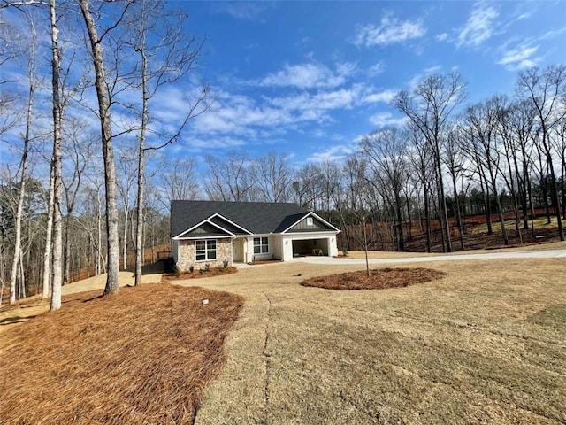 view of front facade with a garage and a front lawn