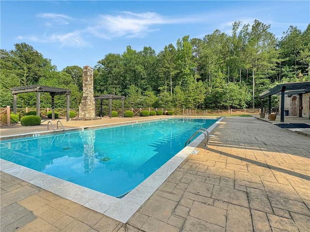 view of pool featuring a pergola and a patio