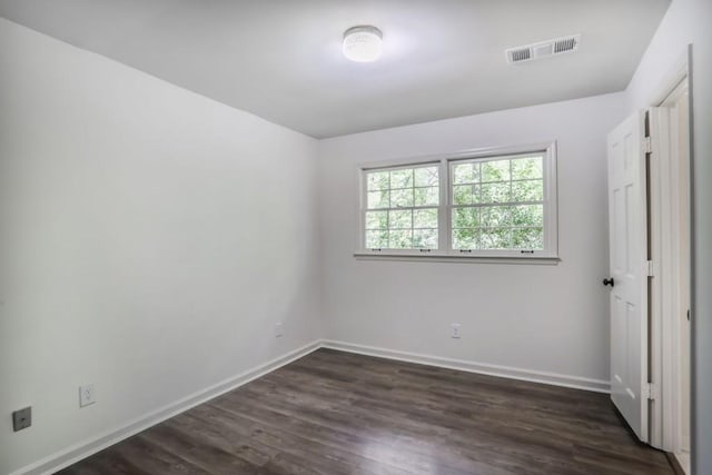 unfurnished bedroom featuring dark wood-style floors and baseboards