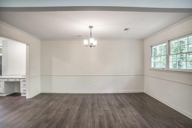 unfurnished dining area featuring crown molding, dark wood-style flooring, a chandelier, and baseboards
