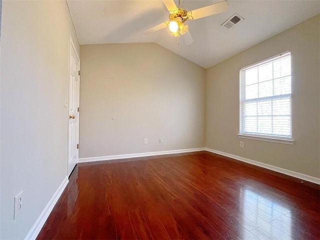 unfurnished room with lofted ceiling, hardwood / wood-style floors, and ceiling fan