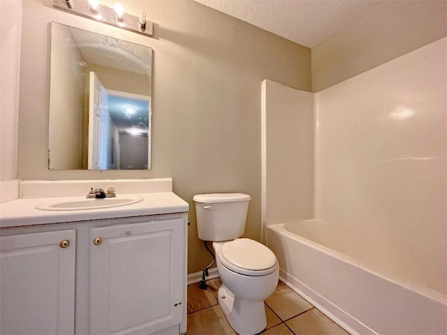 full bathroom with bathtub / shower combination, tile patterned flooring, a textured ceiling, toilet, and vanity