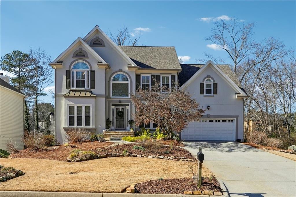 view of front of property with a garage