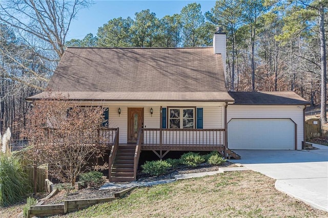 view of front of home with covered porch and a garage