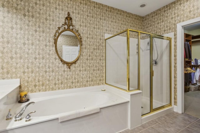 bathroom with tile patterned floors and plus walk in shower