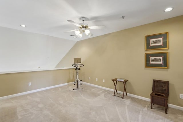 interior space featuring light carpet, lofted ceiling, and ceiling fan