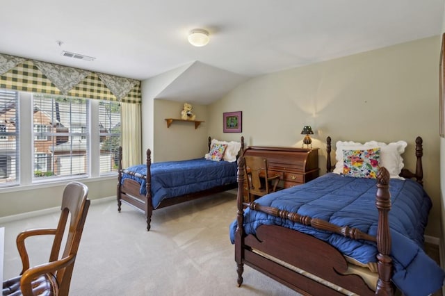 carpeted bedroom featuring lofted ceiling