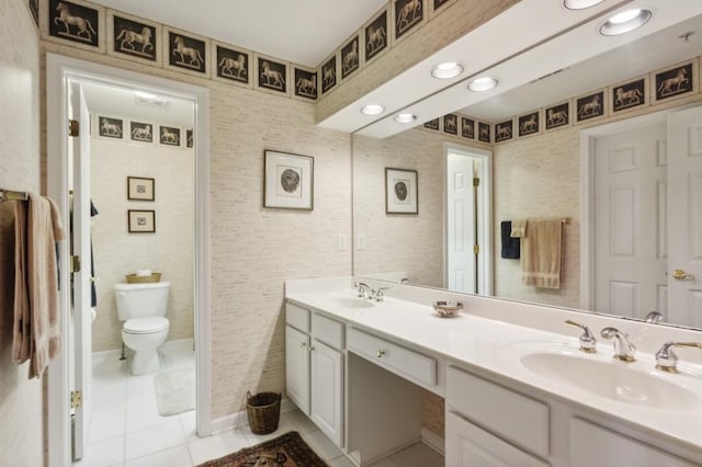 bathroom with vanity, toilet, and tile patterned flooring