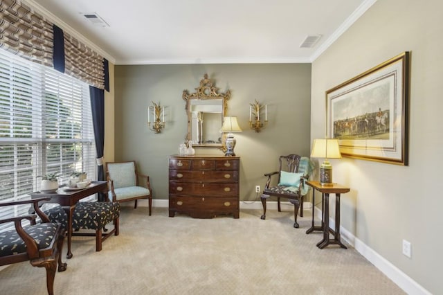 sitting room featuring light carpet and crown molding