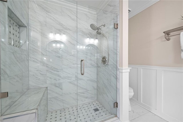1223 Whitlock Ridge Dr SW, Marietta, GA 30064 - bathroom with crown molding, marble look tile flooring, toilet, a shower stall, and wainscoting