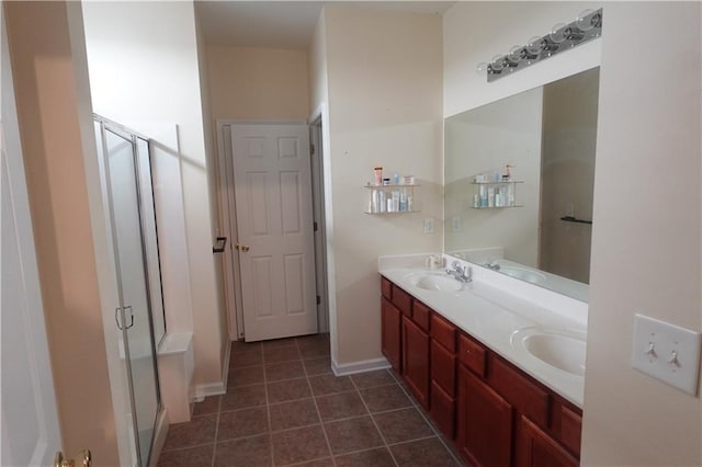 bathroom with vanity, tile patterned floors, and a shower with shower door