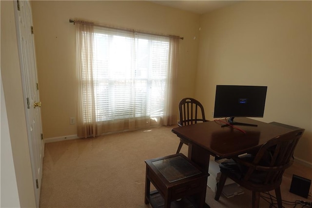 view of carpeted dining area