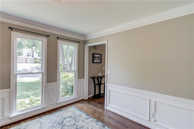 4246 Stilson Cir, Peachtree Corners, GA 30092 - doorway with dark wood-style floors, a wainscoted wall, and ornamental molding