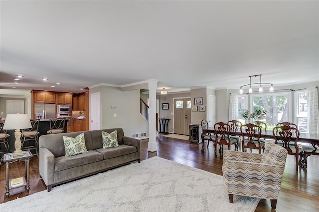 4246 Stilson Cir, Peachtree Corners, GA 30092 - living room with wood finished floors, recessed lighting, stairway, healthy amount of natural light, and crown molding