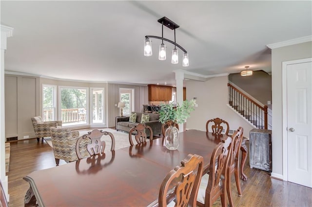 4246 Stilson Cir, Peachtree Corners, GA 30092 - dining space featuring ornamental molding, dark wood finished floors, and stairway
