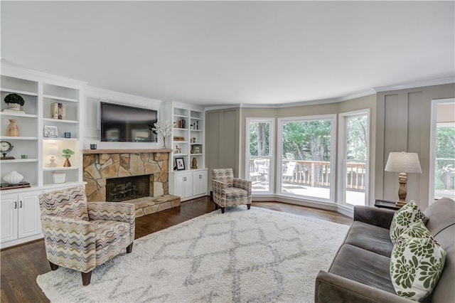 4246 Stilson Cir, Peachtree Corners, GA 30092 - living room with crown molding, dark wood-style flooring, and a fireplace