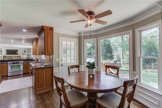 4246 Stilson Cir, Peachtree Corners, GA 30092 - dining room with healthy amount of natural light, dark wood finished floors, ceiling fan, crown molding, and recessed lighting