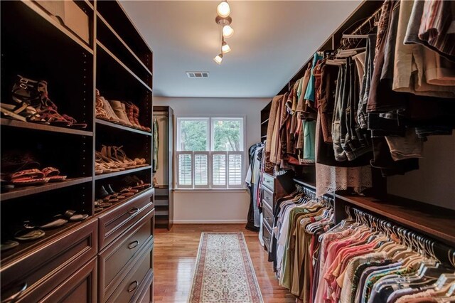 4246 Stilson Cir, Peachtree Corners, GA 30092 - walk in closet featuring light wood-type flooring