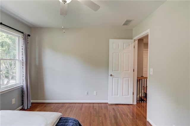 4246 Stilson Cir, Peachtree Corners, GA 30092 - bedroom featuring wood finished floors, baseboards, and ceiling fan