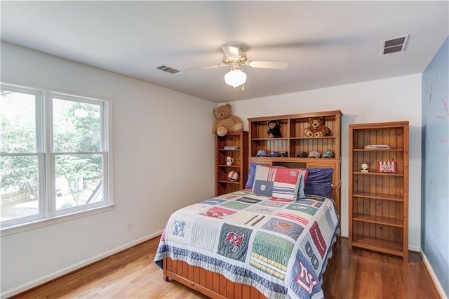 4246 Stilson Cir, Peachtree Corners, GA 30092 - bedroom featuring wood finished floors, baseboards, and a ceiling fan