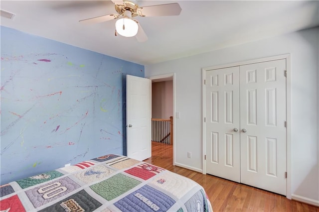 4246 Stilson Cir, Peachtree Corners, GA 30092 - bedroom with light wood-style floors, a closet, and a ceiling fan